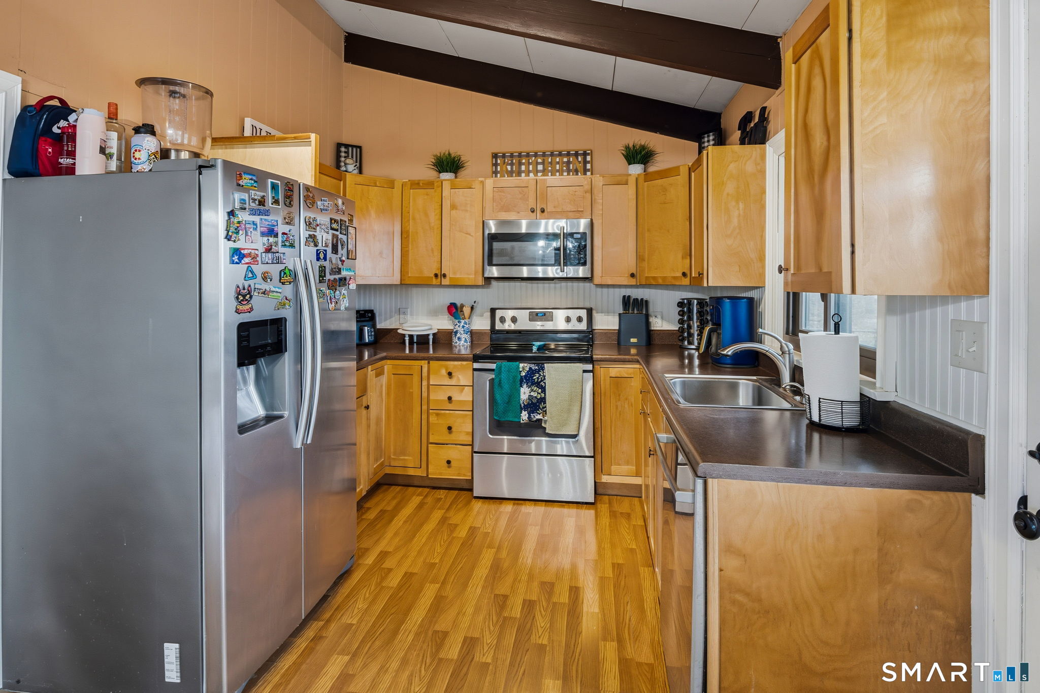 39 Inchcliffe Drive Ledyard, CT 06335 - Photo 28 of 40 a kitchen with stainless steel appliances granite countertop a refrigerator a stove and a sink with wooden floor