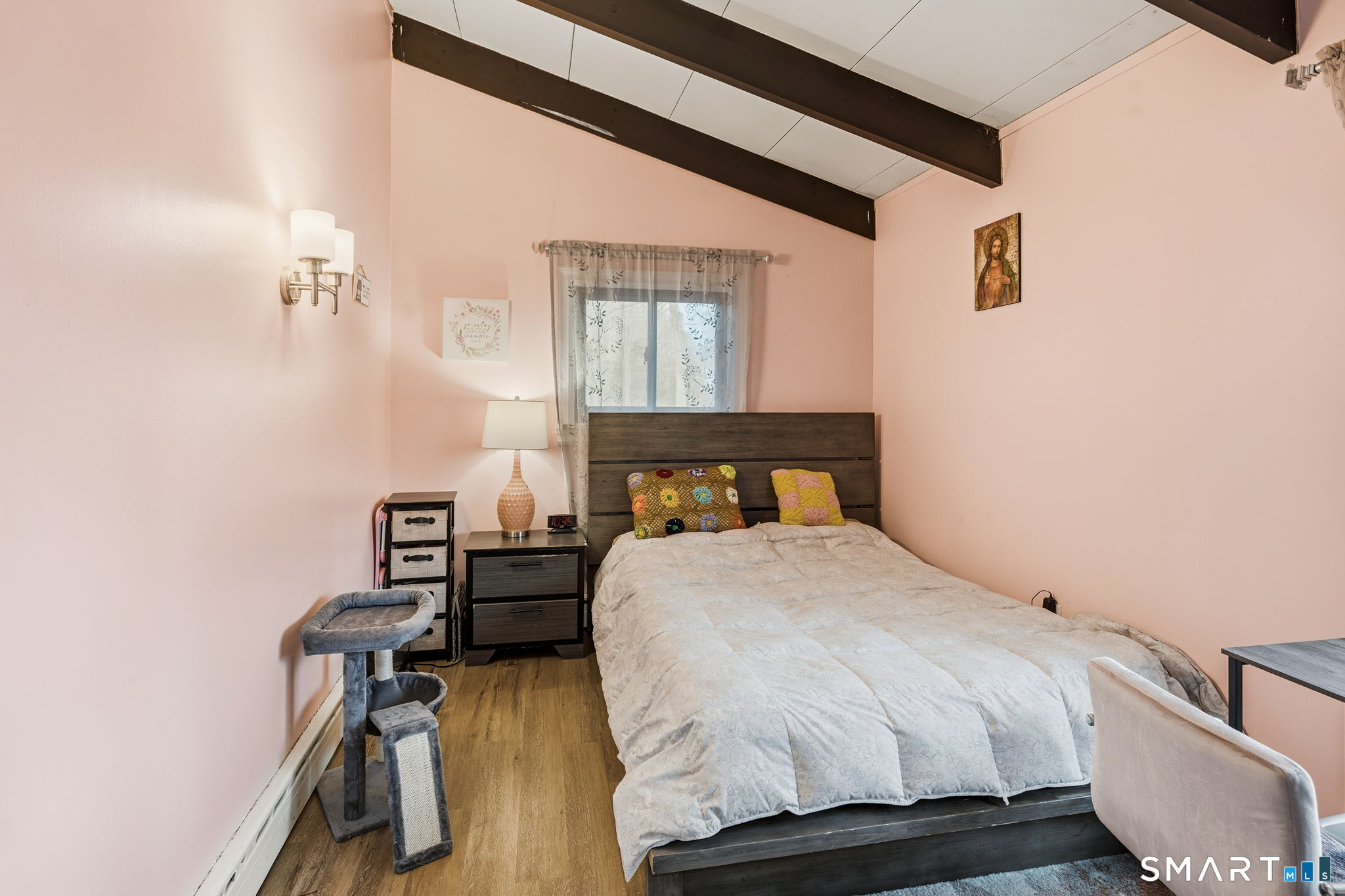 39 Inchcliffe Drive Ledyard, CT 06335 - Photo 31 of 40 a bedroom with a bed and wooden floor