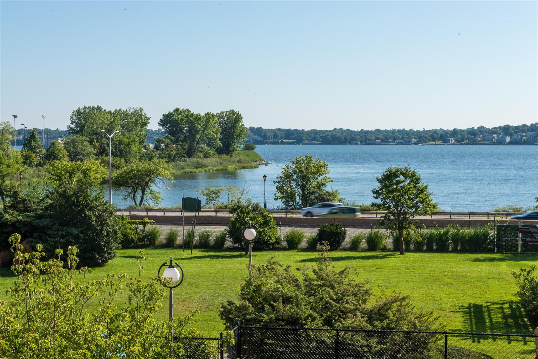17-85 215th Street, Unit 4B Queens, NY 11360 - Photo 19 of 31 Water view featuring fence