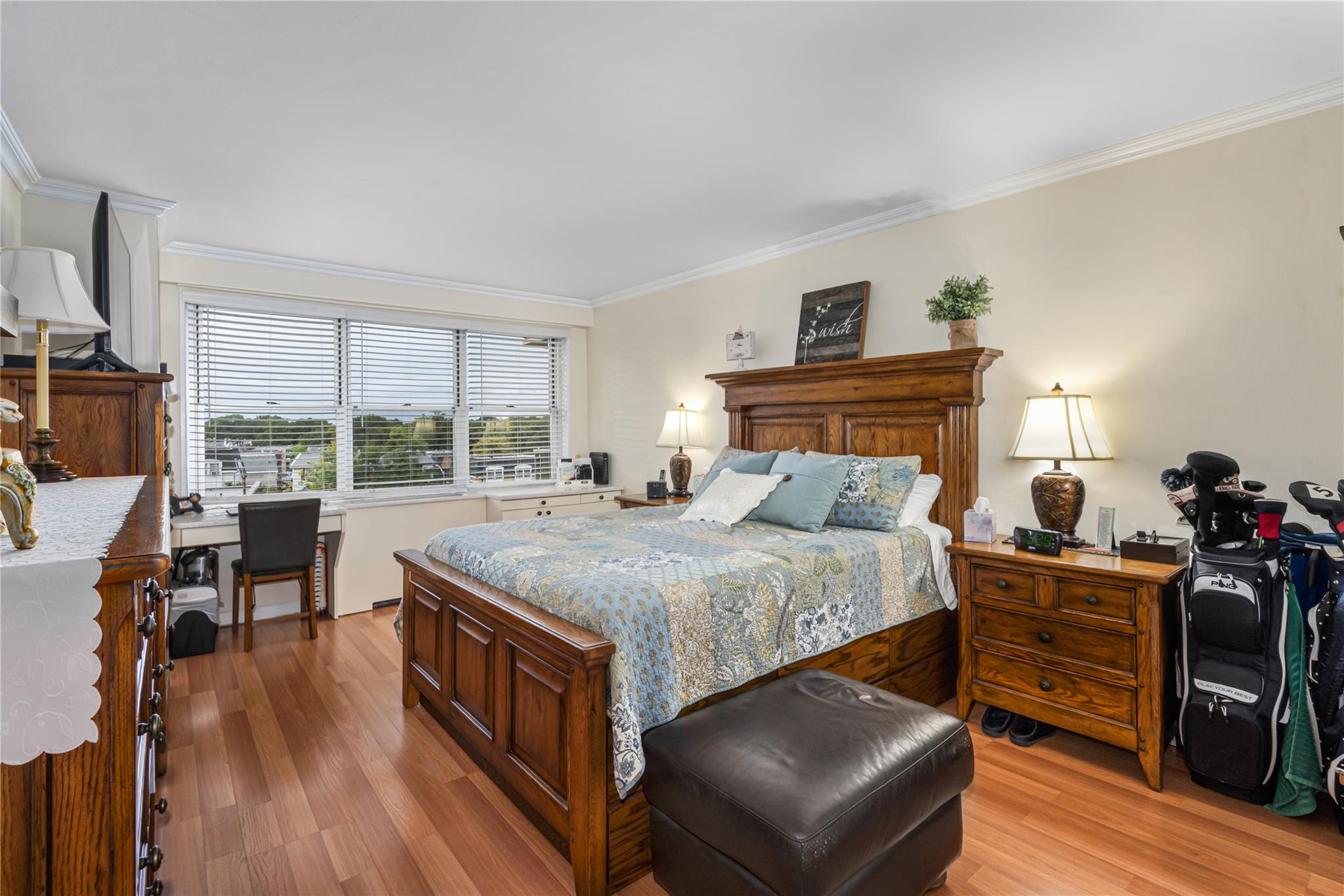 17-85 215th Street, Unit 4B Queens, NY 11360 - Photo 10 of 31 Bedroom featuring ornamental molding, light wood finished floors, and an office area