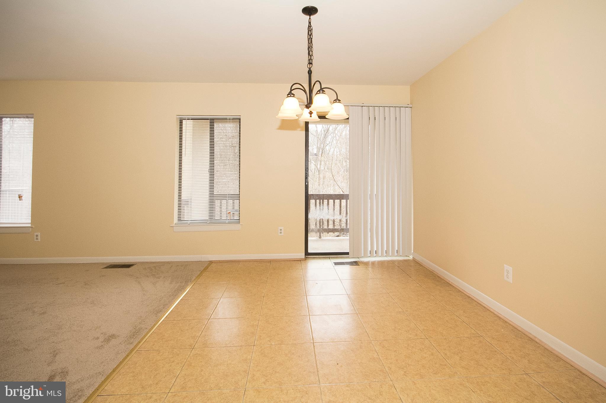 9734 Basket Ring Road Columbia, MD 21045 - Photo 7 of 26 dining room open into a deck