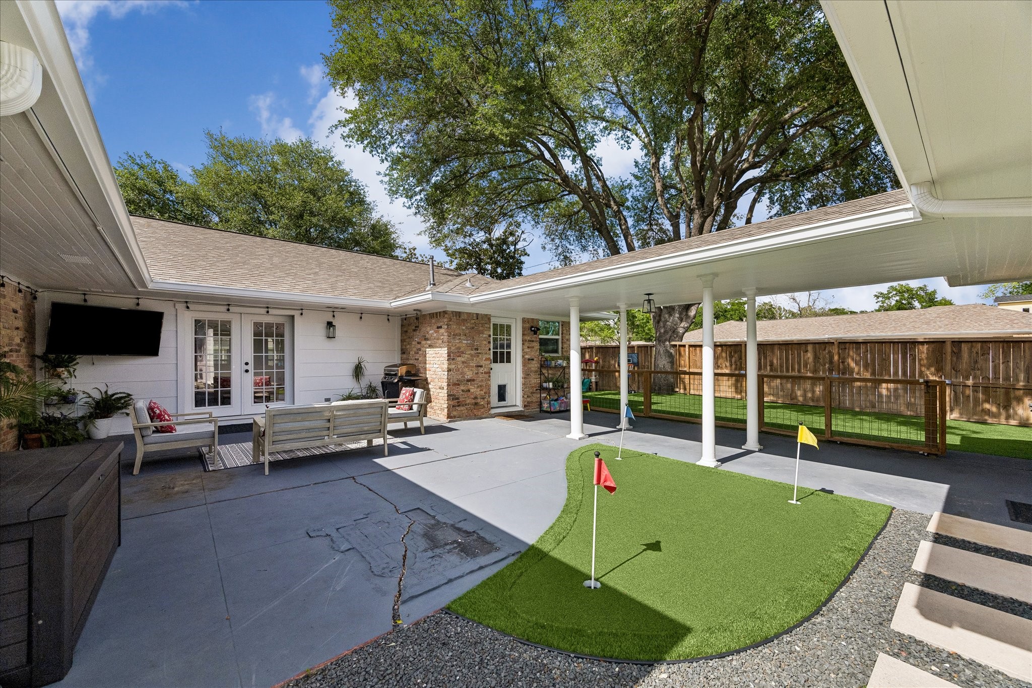 2203 Lamonte Lane Houston, TX 77018 - Photo 19 of 25 a view of a house with backyard sitting area and garden
