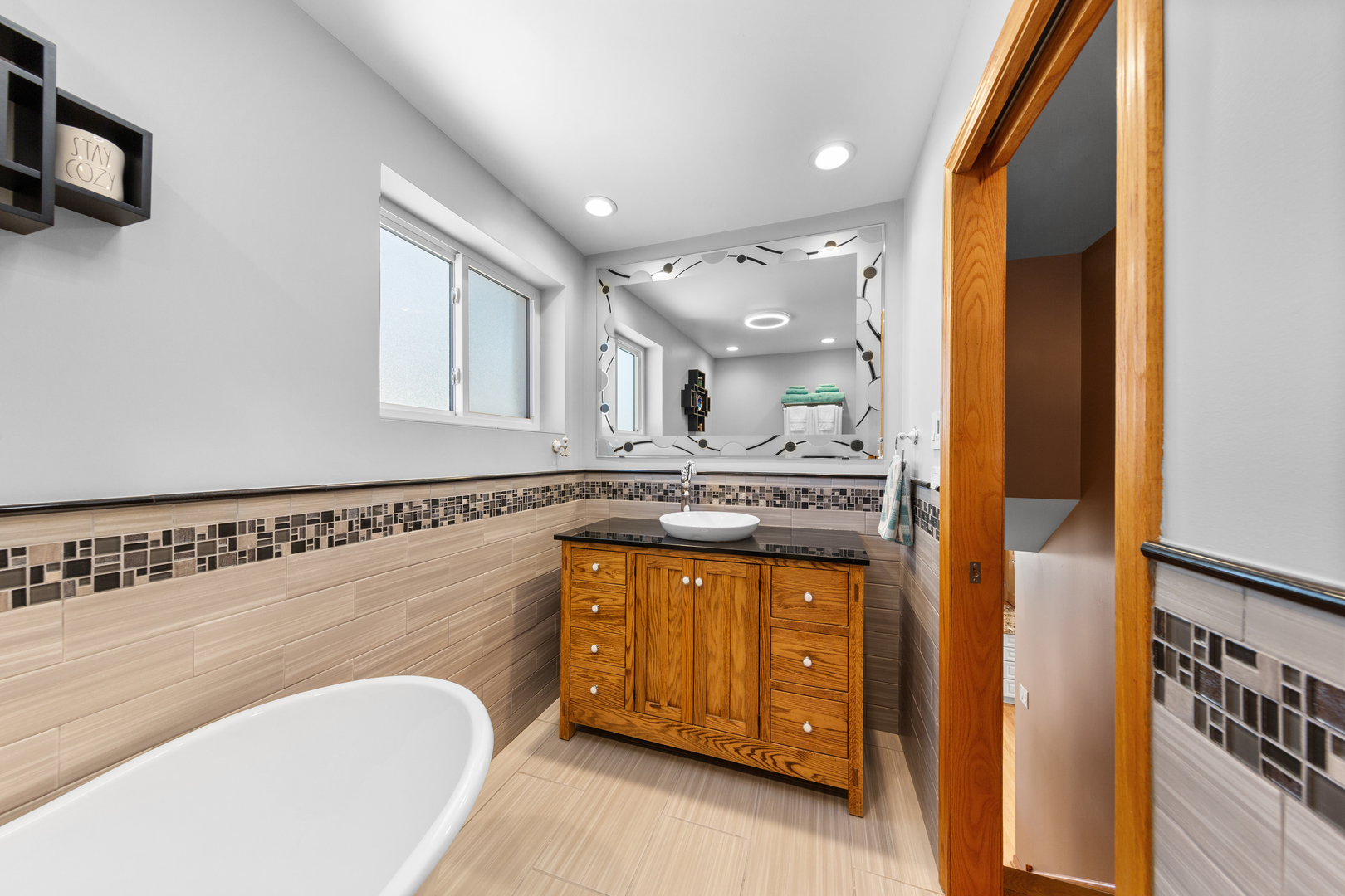 3700 South Normal Avenue Chicago, IL 60609 - Photo 13 of 36 a bathroom with a granite countertop sink mirror and bathtub
