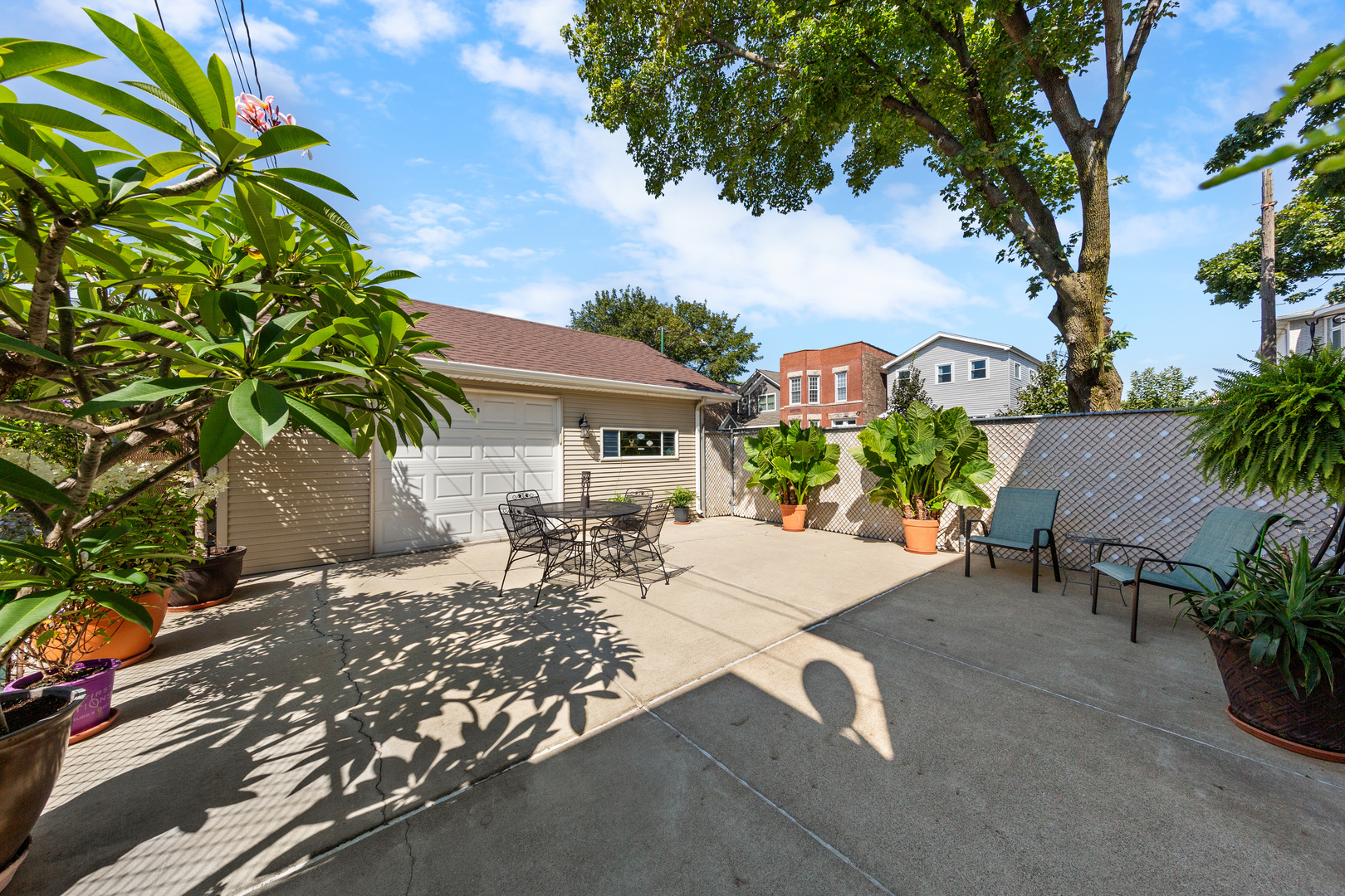3700 South Normal Avenue Chicago, IL 60609 - Photo 29 of 36 a view of a patio with table and chairs under an umbrella