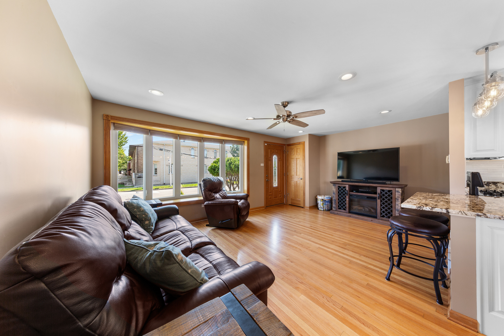 3700 South Normal Avenue Chicago, IL 60609 - Photo 4 of 36 a living room with furniture and a flat screen tv
