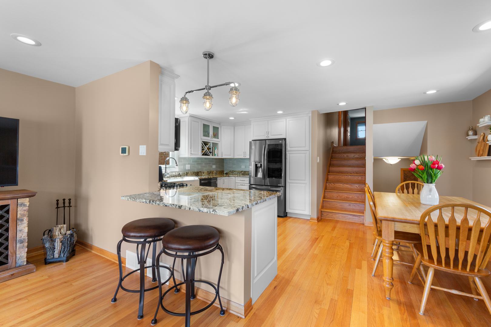 3700 South Normal Avenue Chicago, IL 60609 - Photo 8 of 36 a kitchen with stainless steel appliances kitchen island granite countertop a dining table chairs and granite counter tops