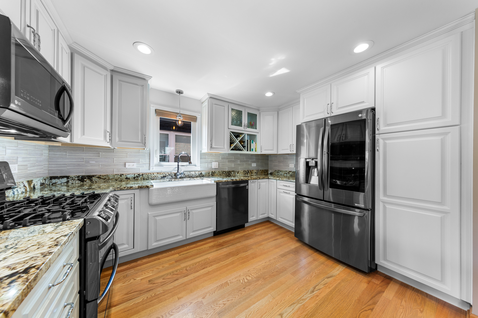 3700 South Normal Avenue Chicago, IL 60609 - Photo 9 of 36 a kitchen with granite countertop stainless steel appliances and wooden cabinets