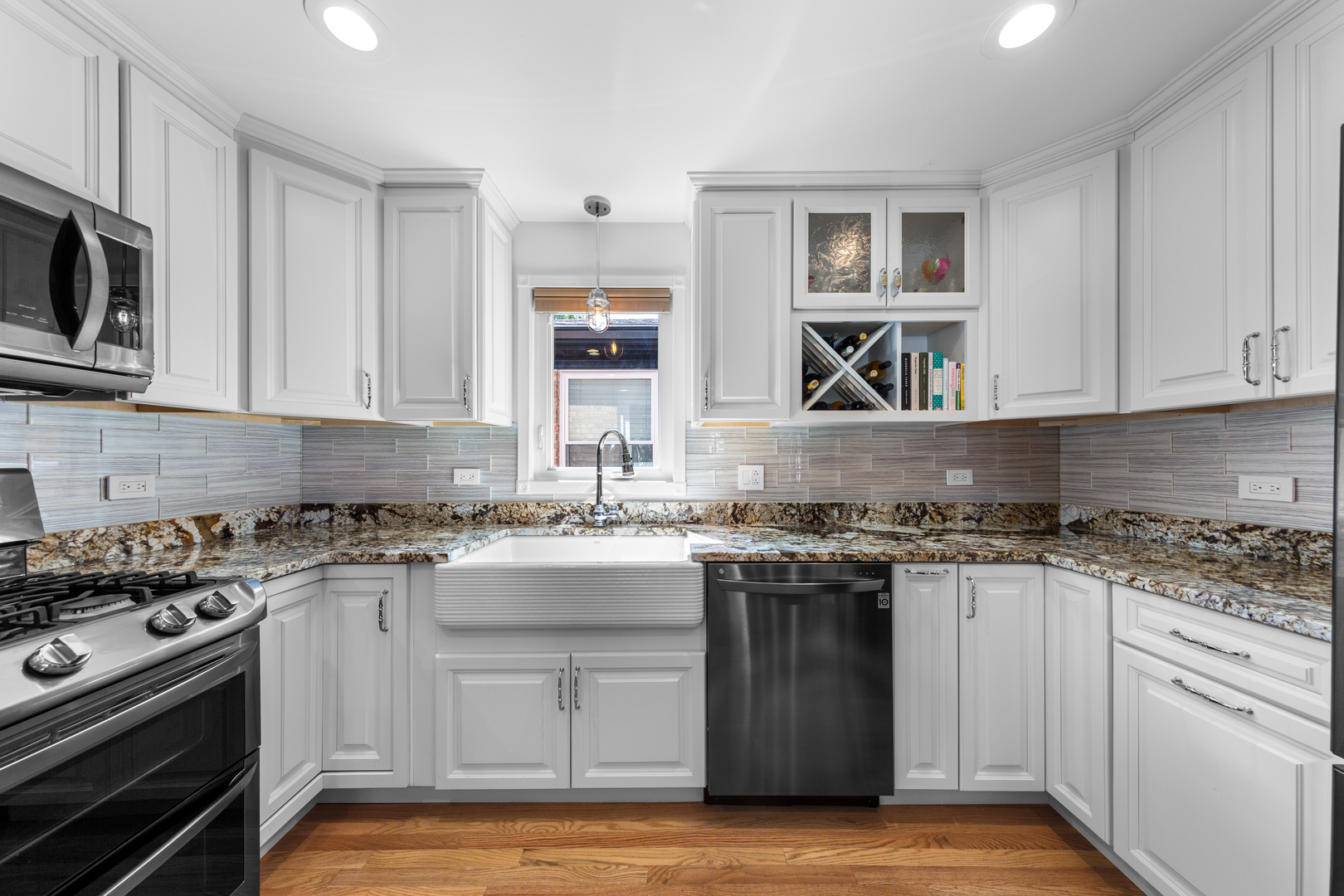 3700 South Normal Avenue Chicago, IL 60609 - Photo 10 of 36 a kitchen with stainless steel appliances granite countertop a stove a sink and a microwave