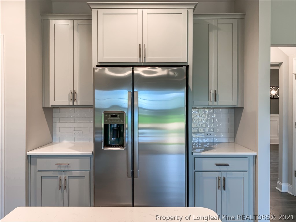 5217 Bree Bridge Road Hope Mills, NC 28348 - Photo 4 of 6 a kitchen with a refrigerator and cabinets