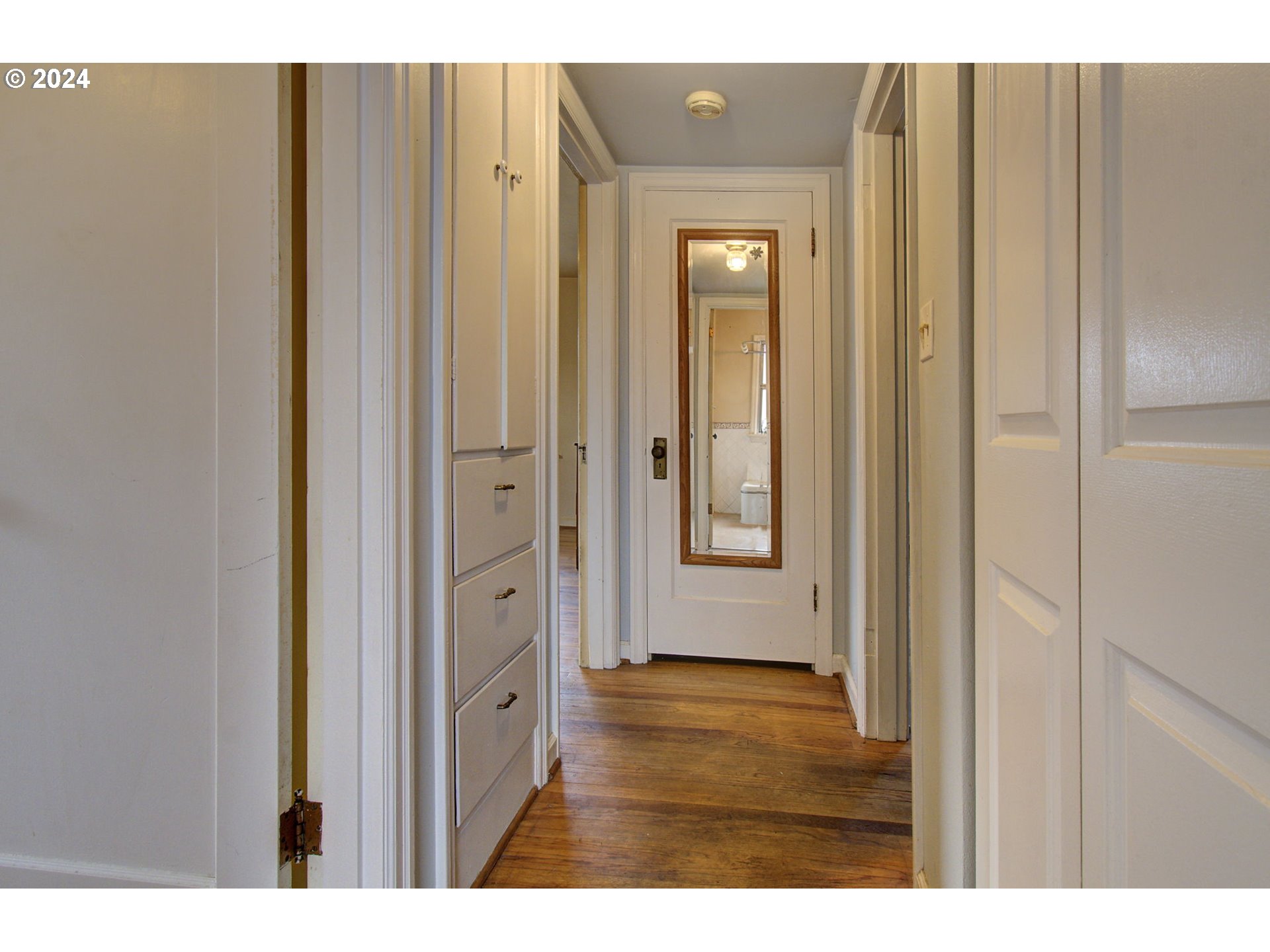 168 Southeast Whitney Street Camas, WA 98607 - Photo 13 of 32 a view of a hallway with wooden floor