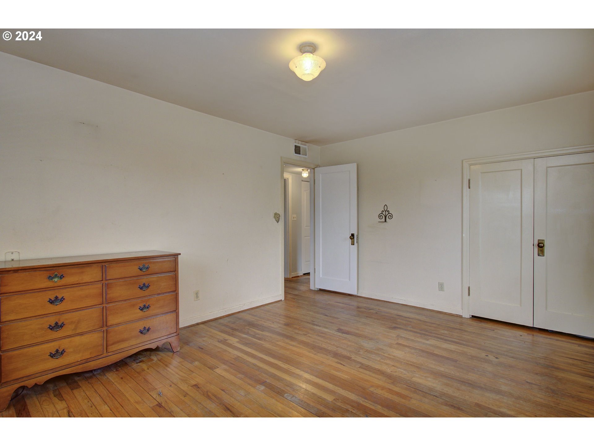 168 Southeast Whitney Street Camas, WA 98607 - Photo 15 of 32 a view of an empty room with wooden floor