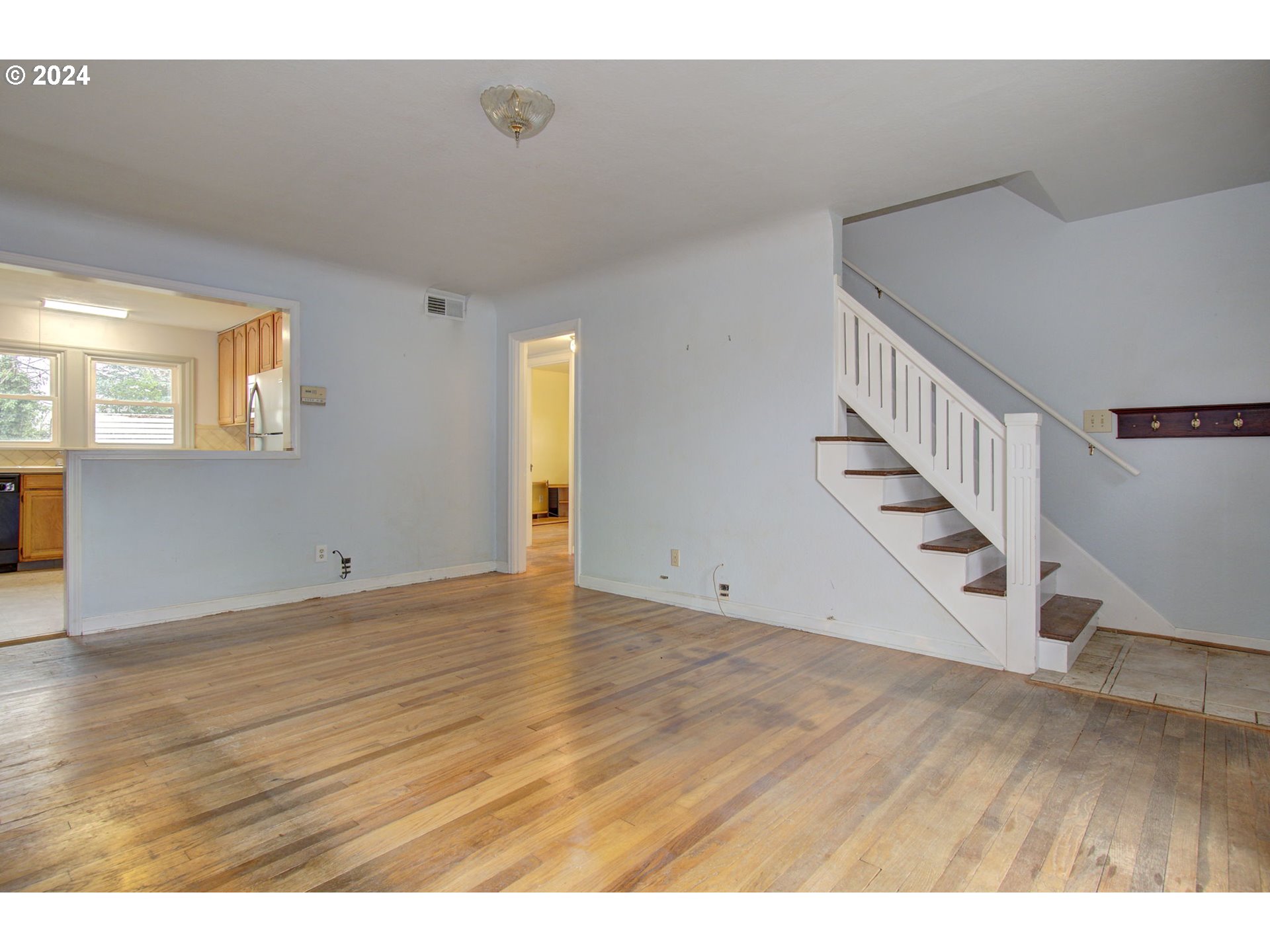 168 Southeast Whitney Street Camas, WA 98607 - Photo 8 of 32 a view of an empty room with wooden floor