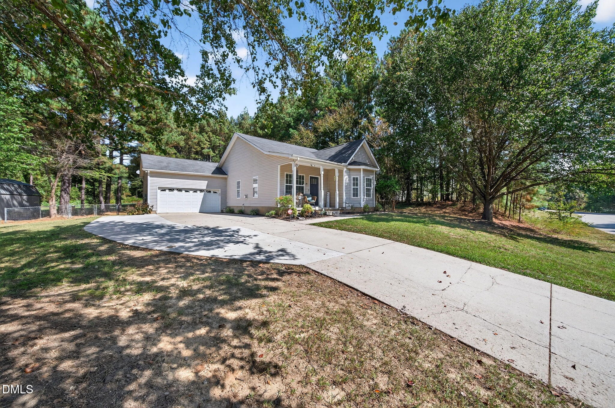 25 Hillside Village Drive Louisburg, NC 27549 - Photo 1 of 35 a front view of a house with a yard and trees