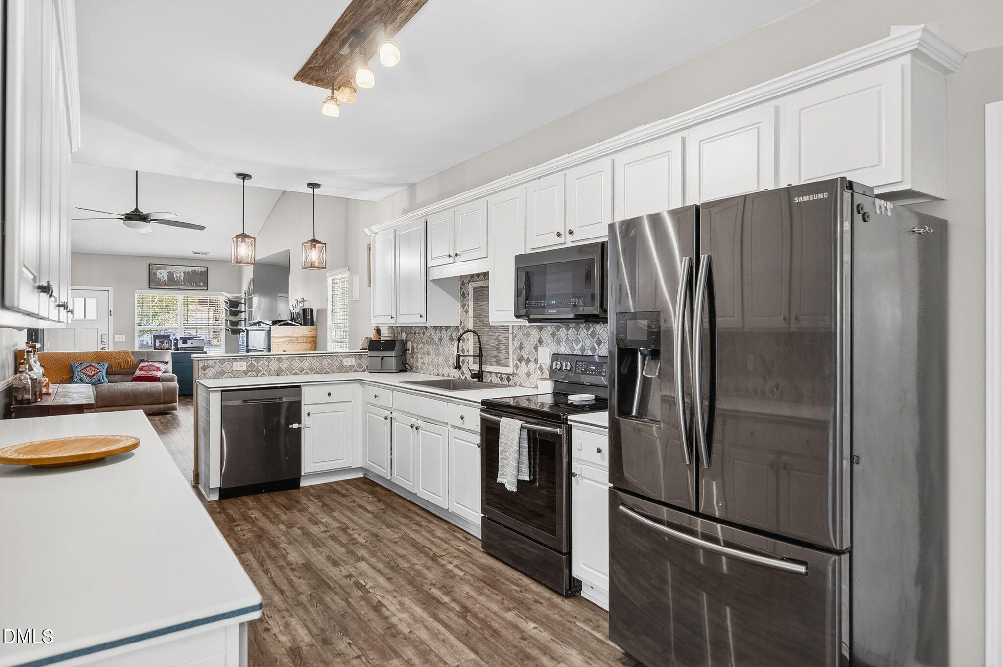25 Hillside Village Drive Louisburg, NC 27549 - Photo 11 of 35 a kitchen with a refrigerator a sink and dishwasher