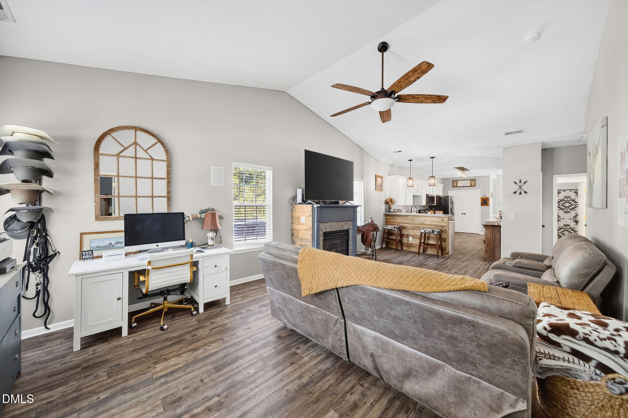 25 Hillside Village Drive Louisburg, NC 27549 - Photo 15 of 35 a living room with furniture and a flat screen tv with kitchen view