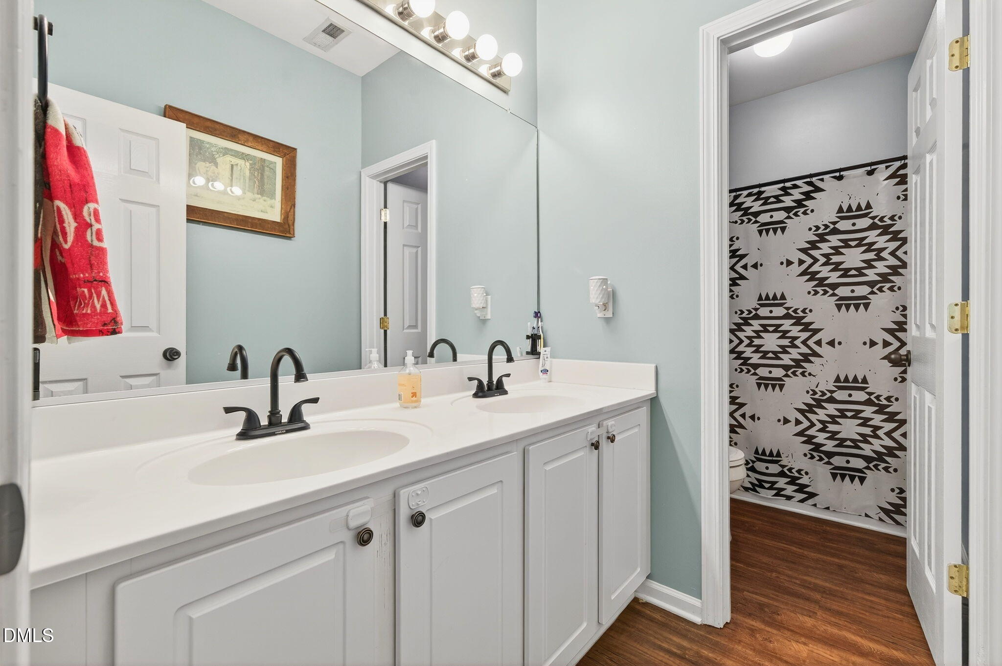 25 Hillside Village Drive Louisburg, NC 27549 - Photo 21 of 35 a bathroom with a sink and a mirror