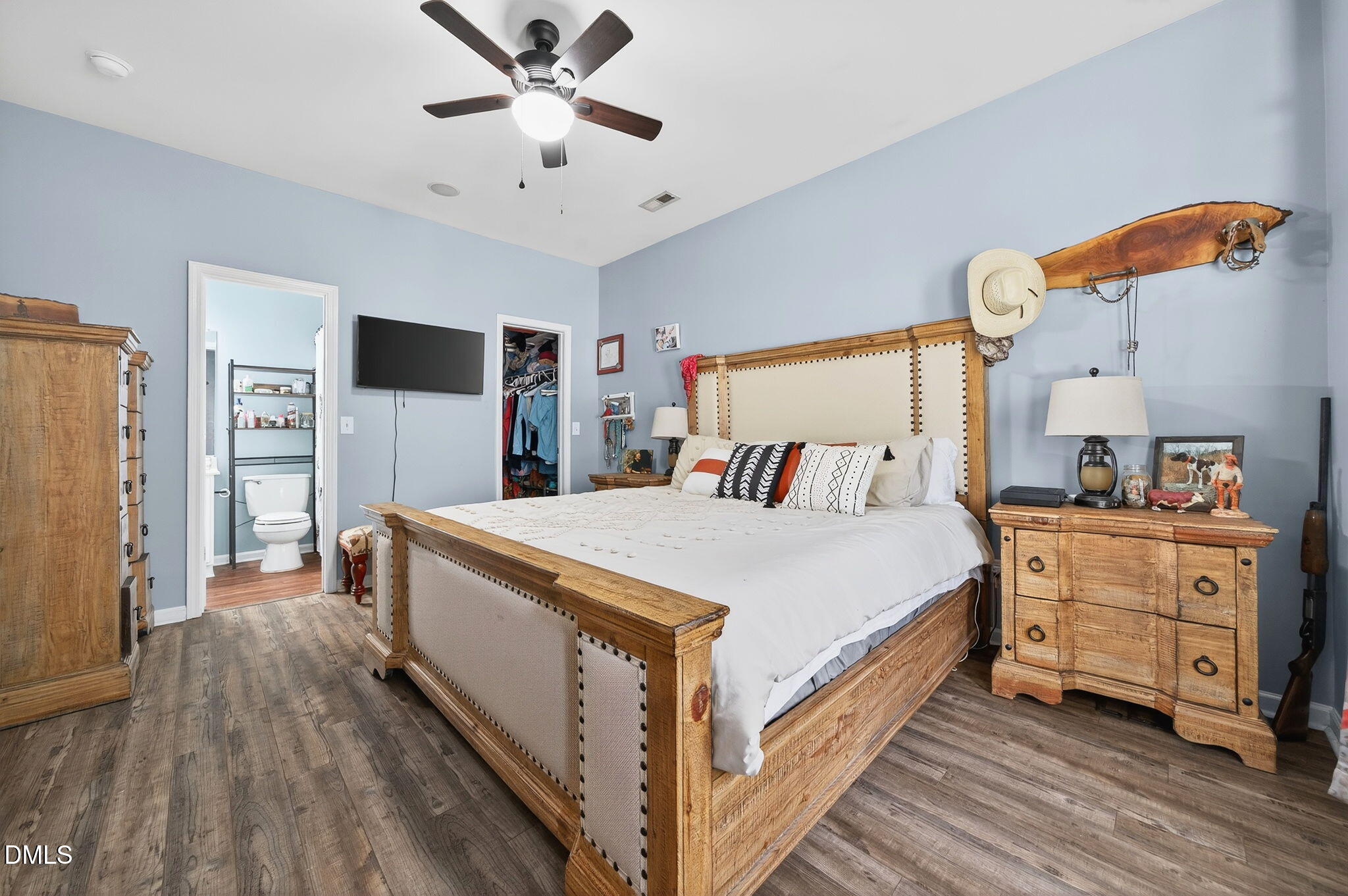 25 Hillside Village Drive Louisburg, NC 27549 - Photo 23 of 35 a bed room with a bed and a dresser