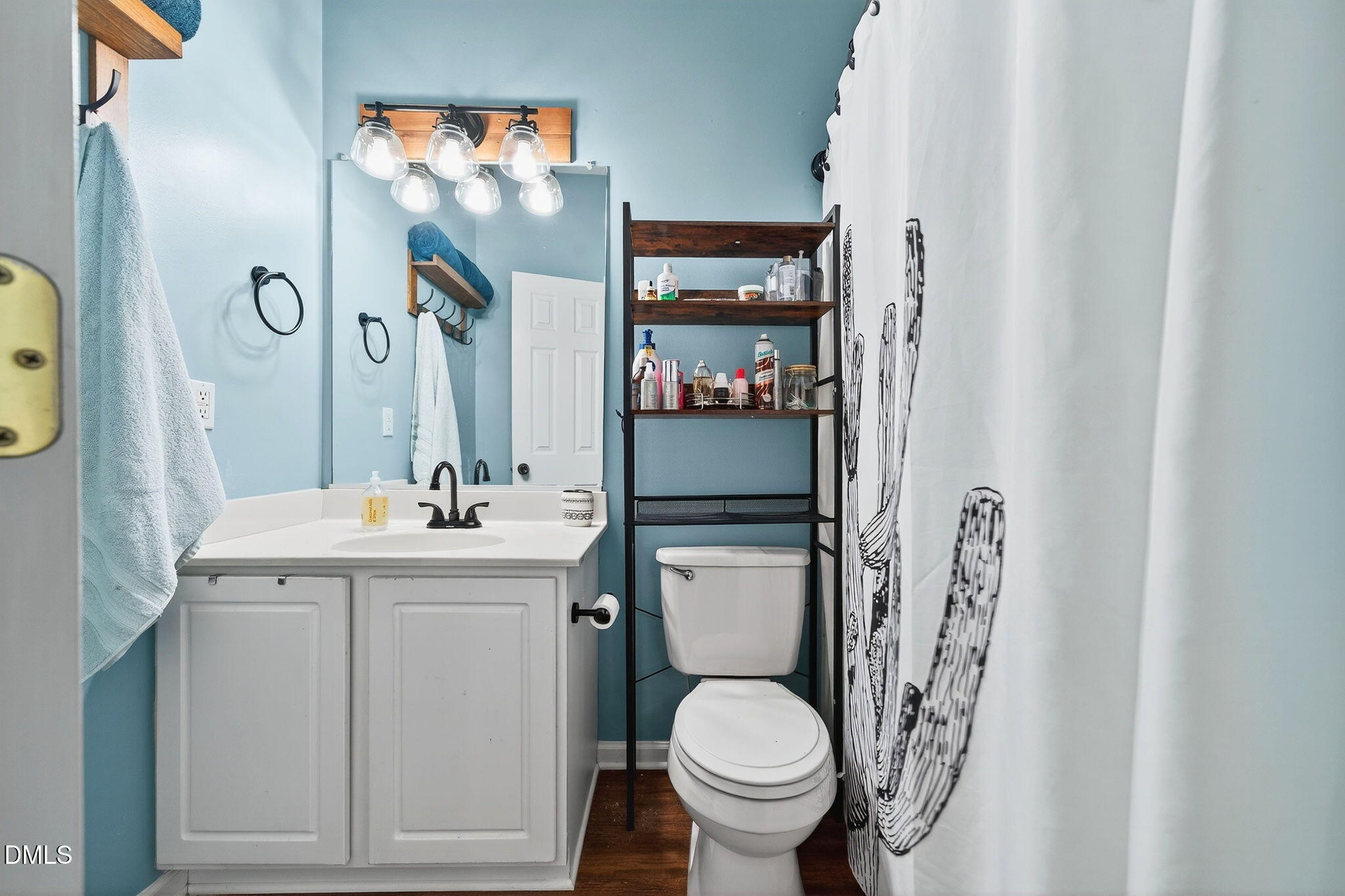 25 Hillside Village Drive Louisburg, NC 27549 - Photo 24 of 35 a bathroom with a toilet sink and mirror