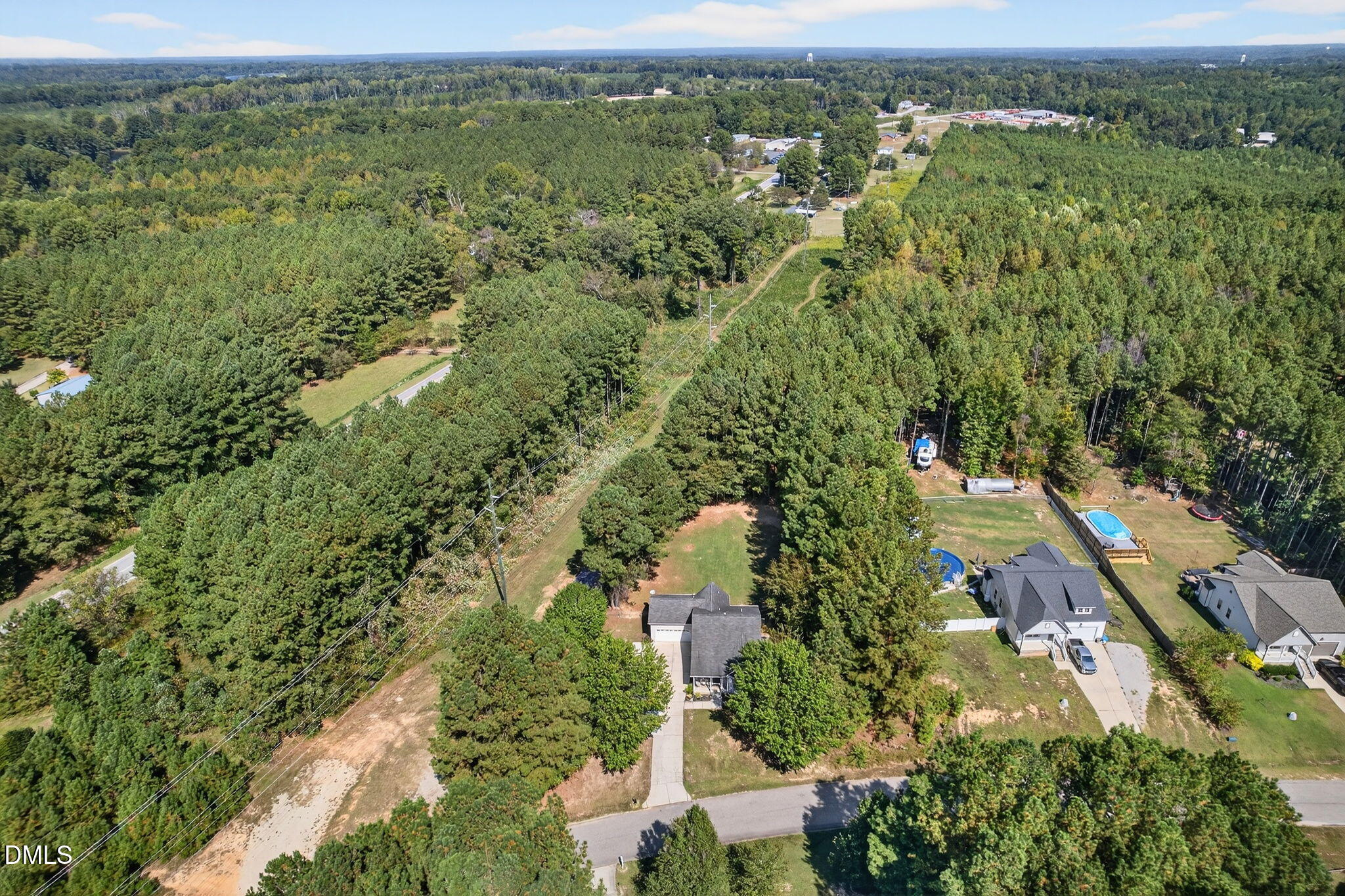 25 Hillside Village Drive Louisburg, NC 27549 - Photo 34 of 35 an aerial view of residential houses with outdoor space and trees