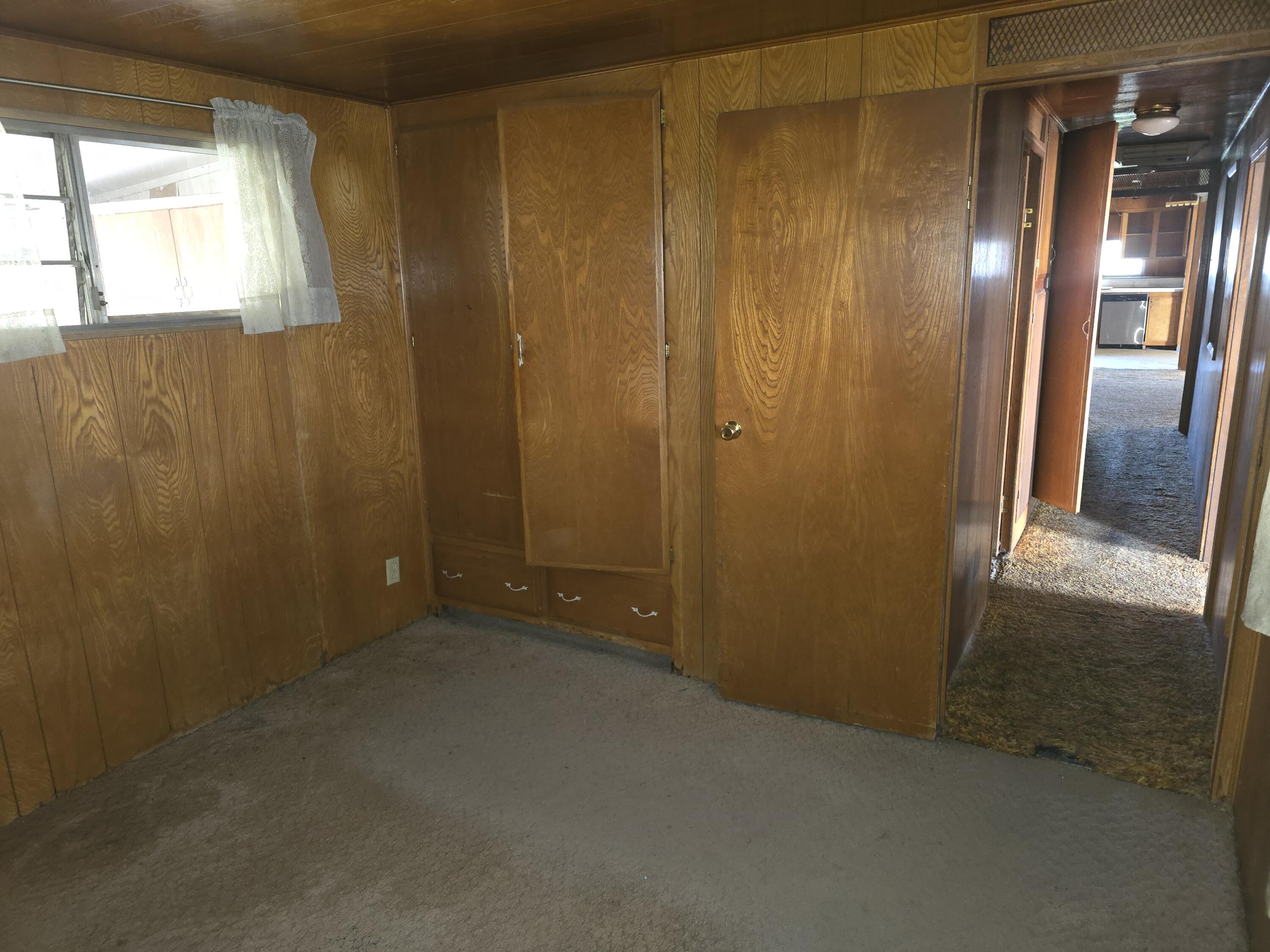 31974 Drews Road Chiloquin, OR 97624 - Photo 12 of 25 an empty room with wooden floor and windows