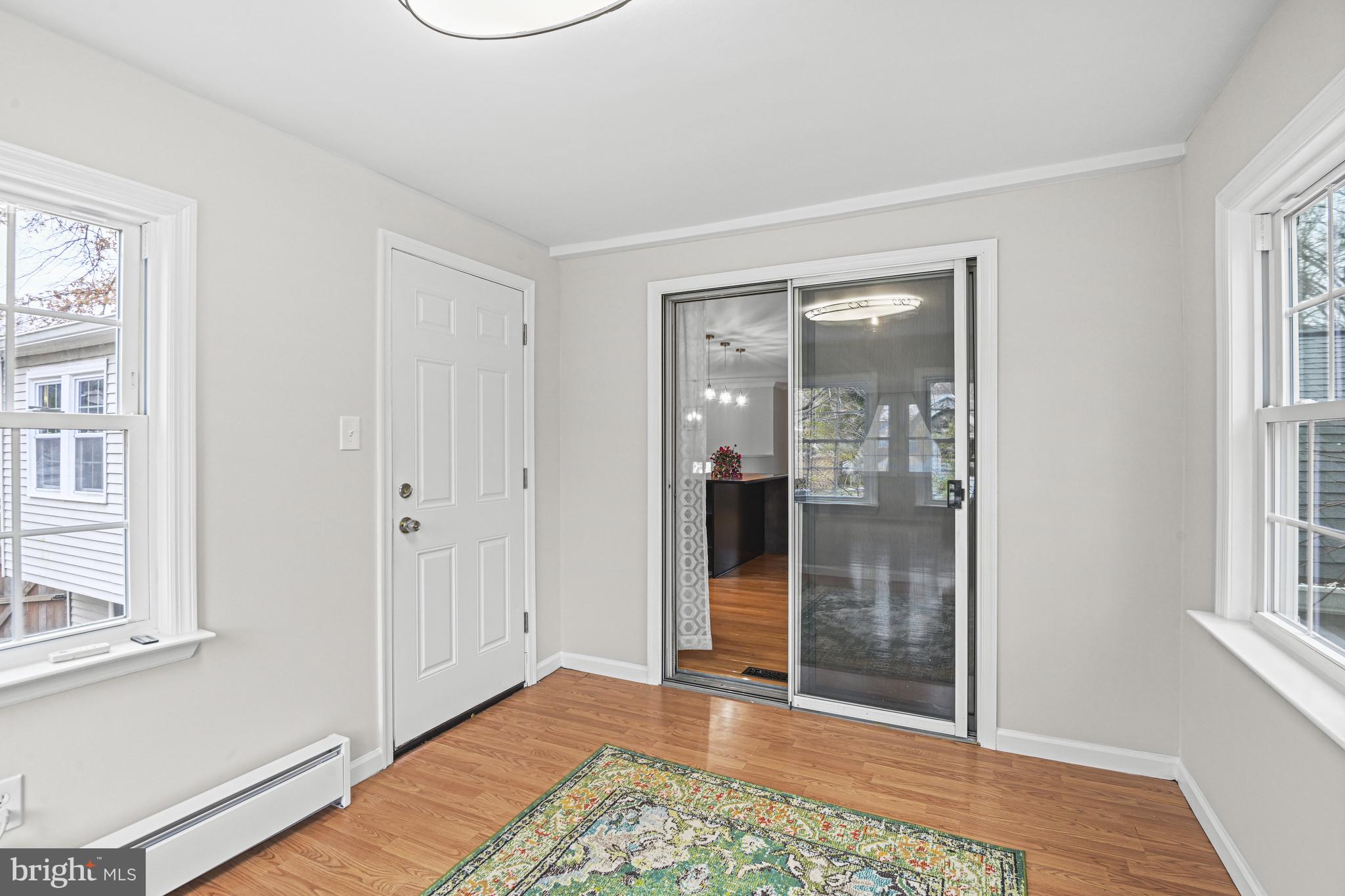 532 Merlins Lane Herndon, VA 20170 - Photo 15 of 42 a view of a room with wooden floor and windows