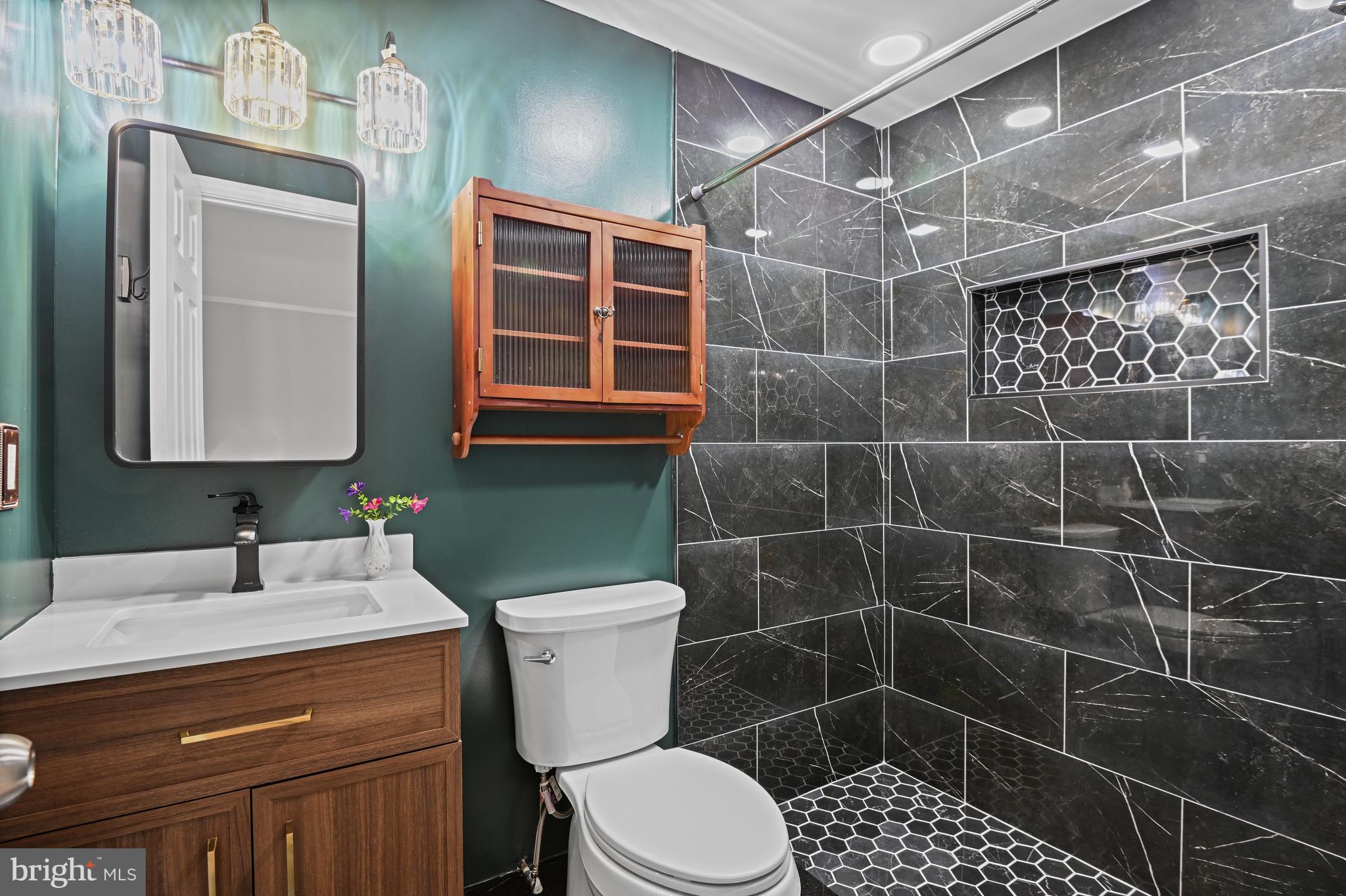 532 Merlins Lane Herndon, VA 20170 - Photo 18 of 42 a bathroom with a toilet sink and shower