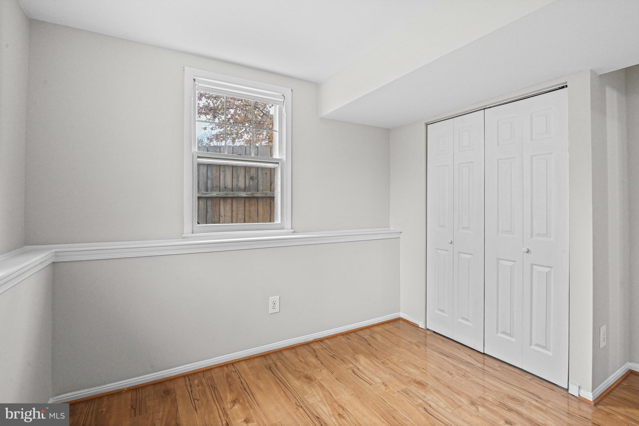 532 Merlins Lane Herndon, VA 20170 - Photo 25 of 42 wooden floor in an empty room with a window