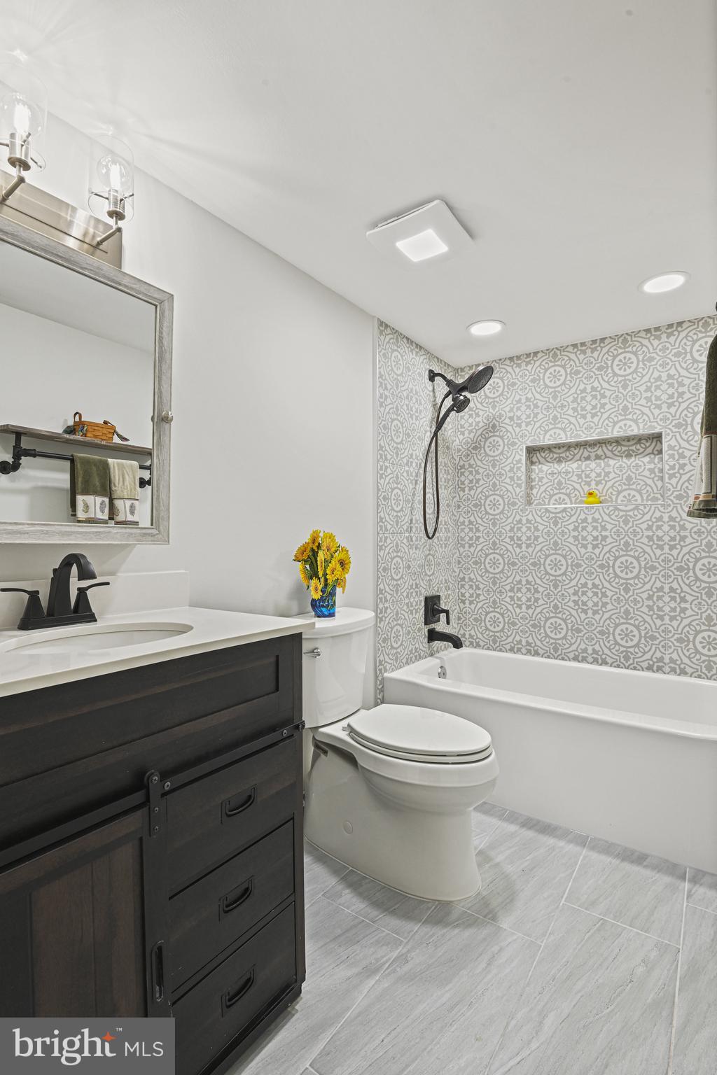 532 Merlins Lane Herndon, VA 20170 - Photo 35 of 42 a bathroom with a sink a toilet and shower