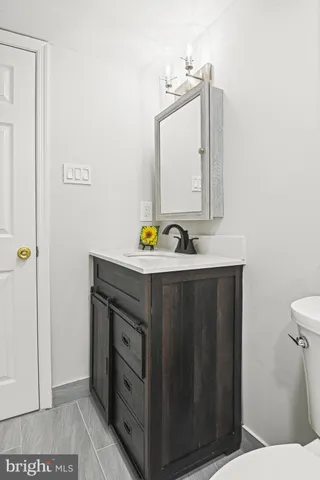 a view of a house with wooden fence