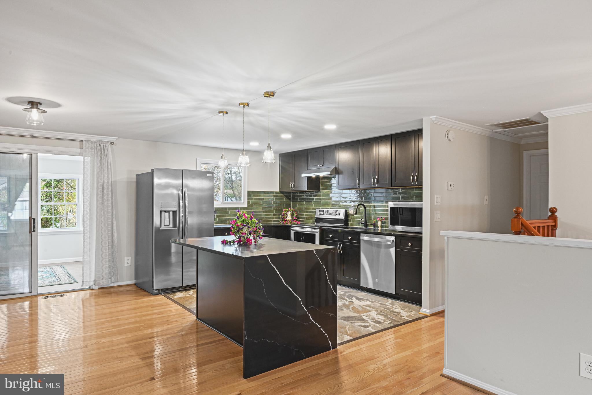 532 Merlins Lane Herndon, VA 20170 - Photo 4 of 42 a kitchen with refrigerator and cabinets