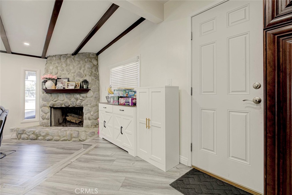 10317 Pinyon Avenue Tujunga, CA 91042 - Photo 12 of 41 a living room with furniture and a fireplace