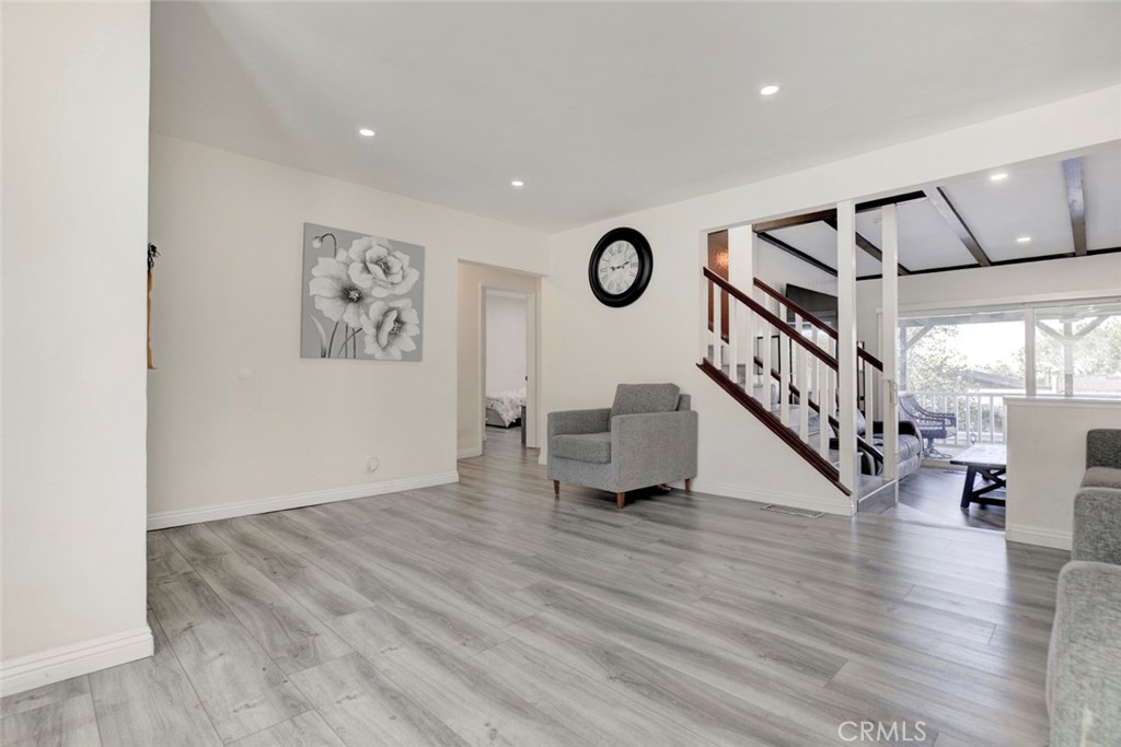 10317 Pinyon Avenue Tujunga, CA 91042 - Photo 15 of 41 a view of an empty room with wooden floor