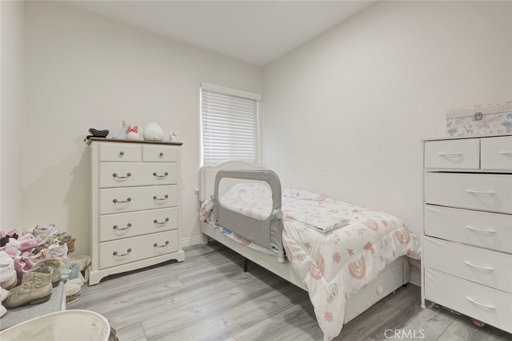 10317 Pinyon Avenue Tujunga, CA 91042 - Photo 20 of 41 a bedroom with a bed and a dresser