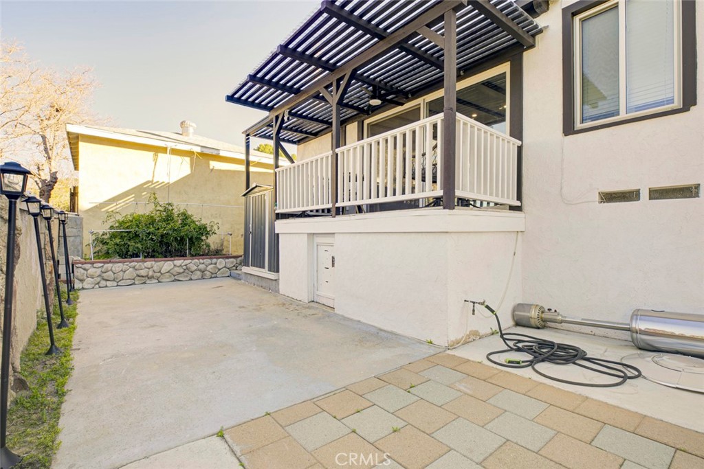 10317 Pinyon Avenue Tujunga, CA 91042 - Photo 33 of 41 a backyard of a house with table and chairs