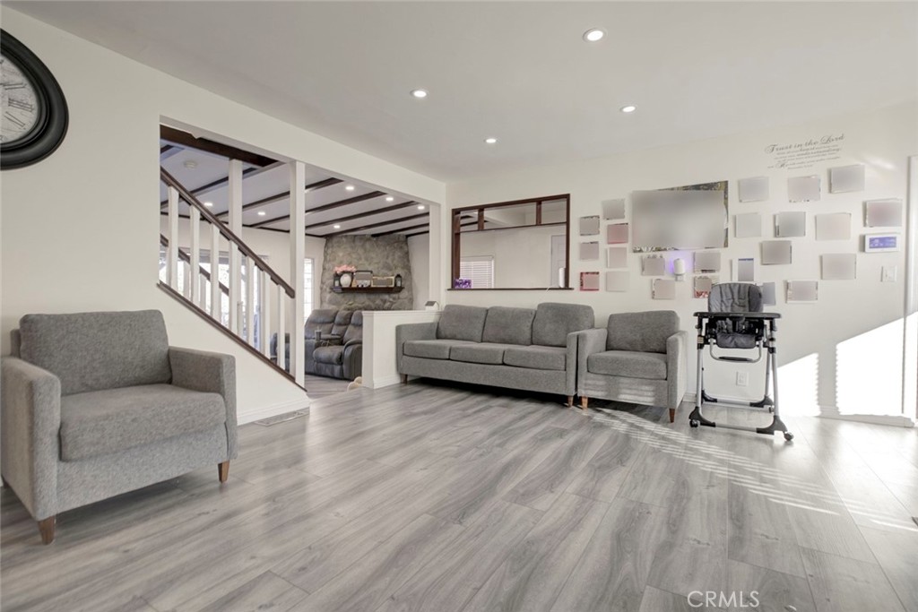 10317 Pinyon Avenue Tujunga, CA 91042 - Photo 6 of 41 a living room with furniture and a wooden floor