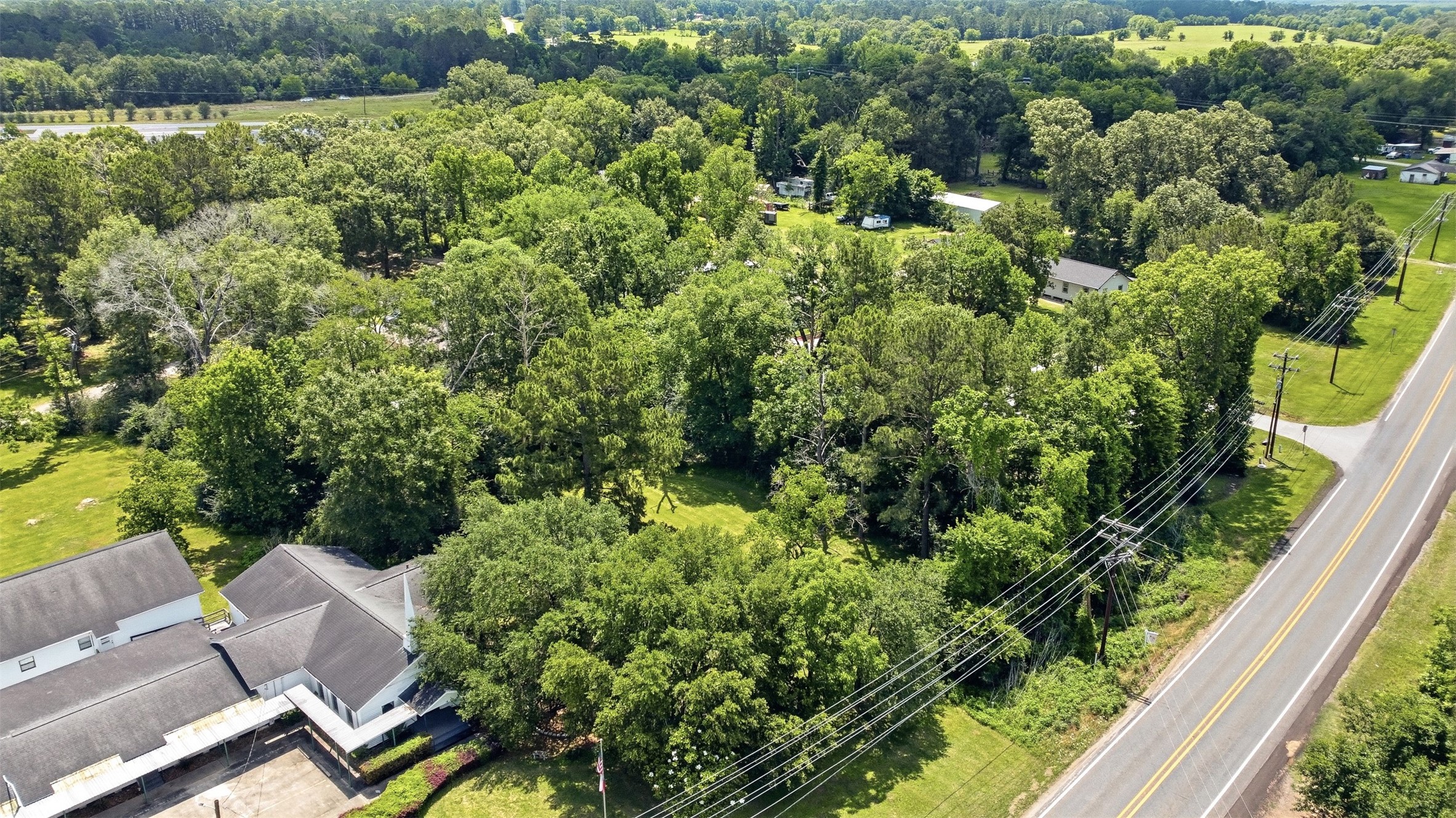 0 State Highway Loop Goodrich, TX 77335 - Photo 14 of 22 an aerial view of residential house with outdoor space and trees all around
