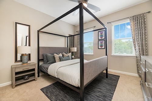 372 East Ash Street Cochran, GA 31014 - Photo 3 of 6 a bedroom with a bed wooden floor and window