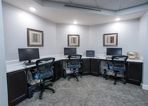 a view of a workspace with furniture