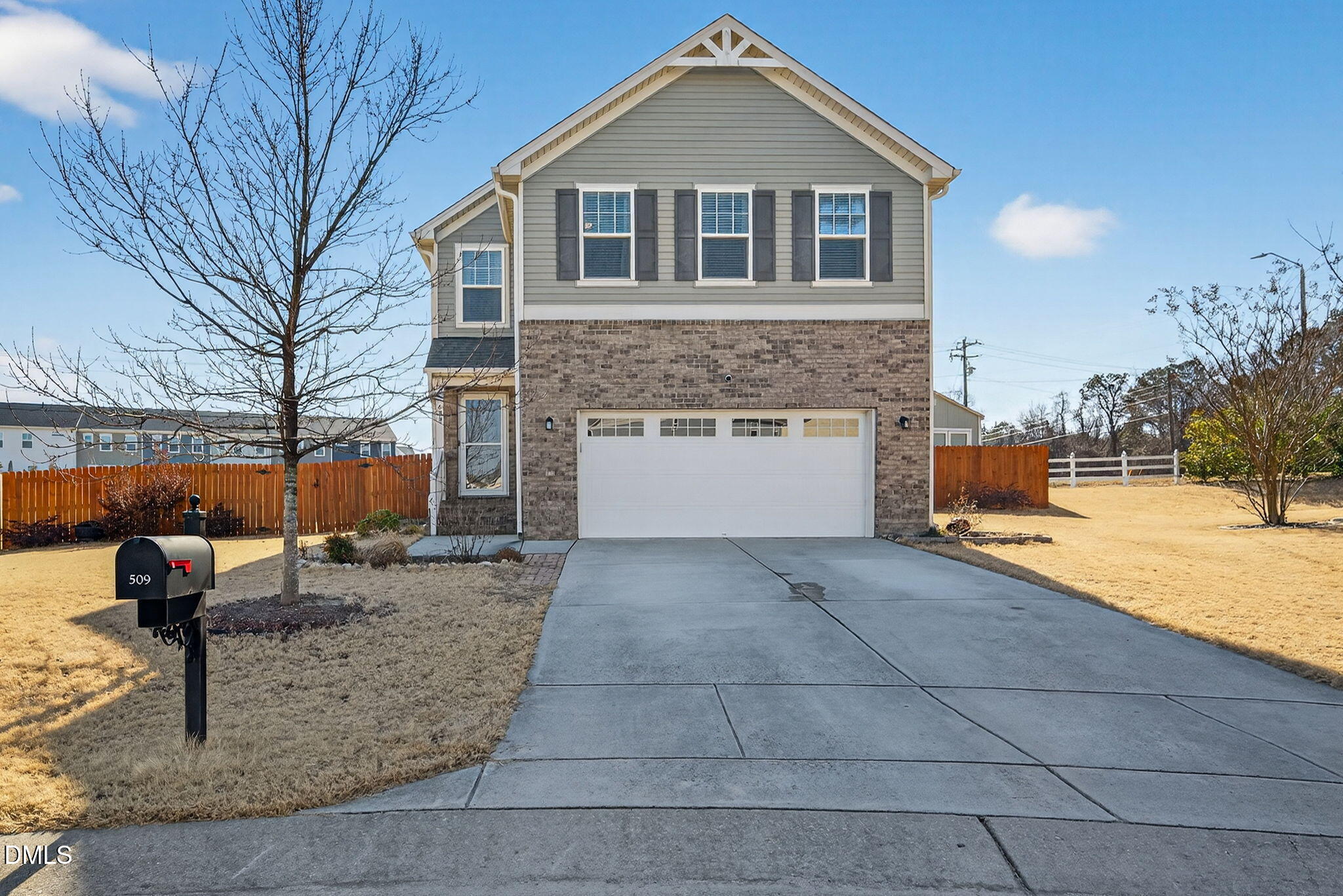 509 Houndstooth Lane Wendell, NC 27591 - Photo 1 of 33 a front view of a house with a yard