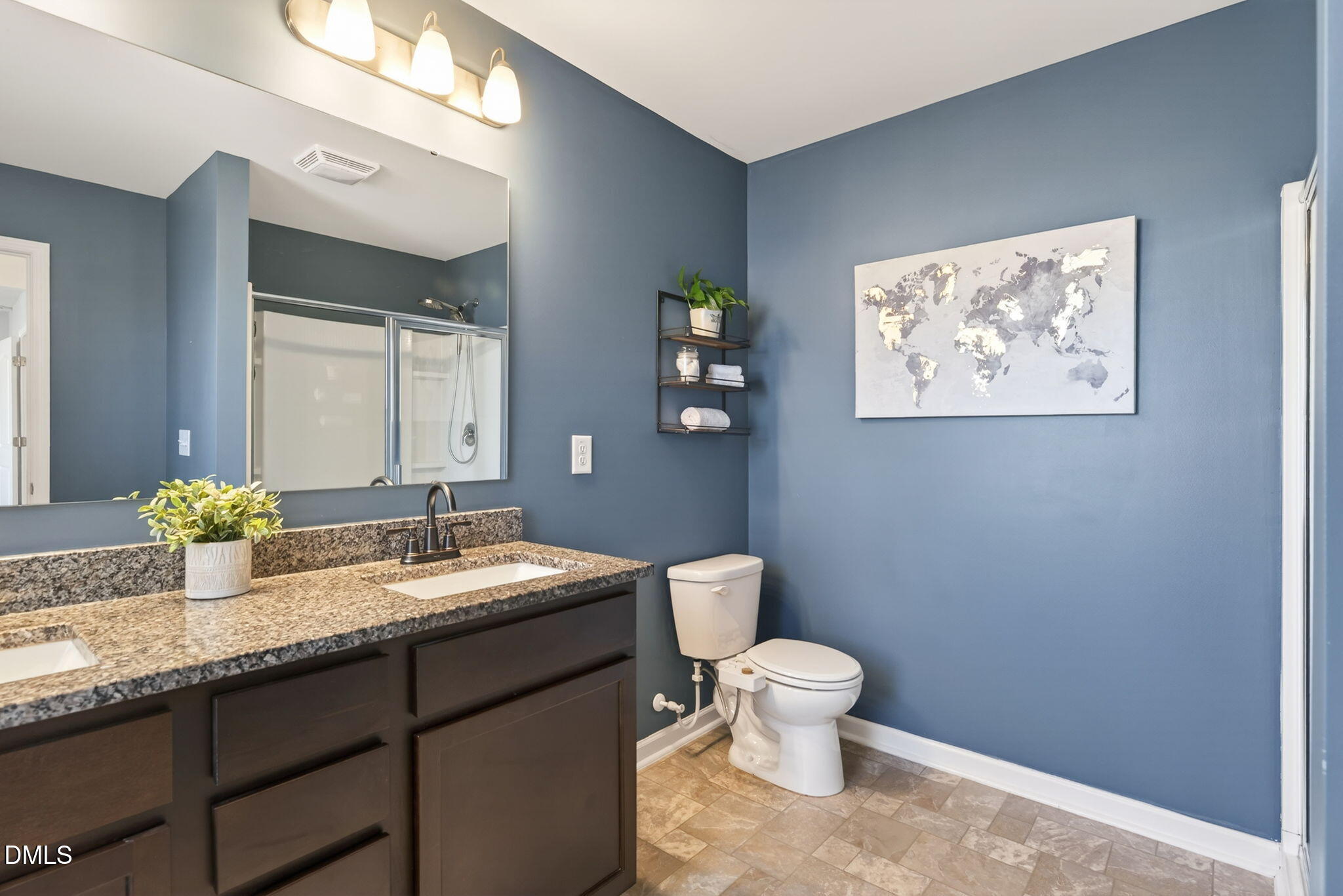 509 Houndstooth Lane Wendell, NC 27591 - Photo 22 of 33 a bathroom with a granite countertop sink a toilet and a mirror