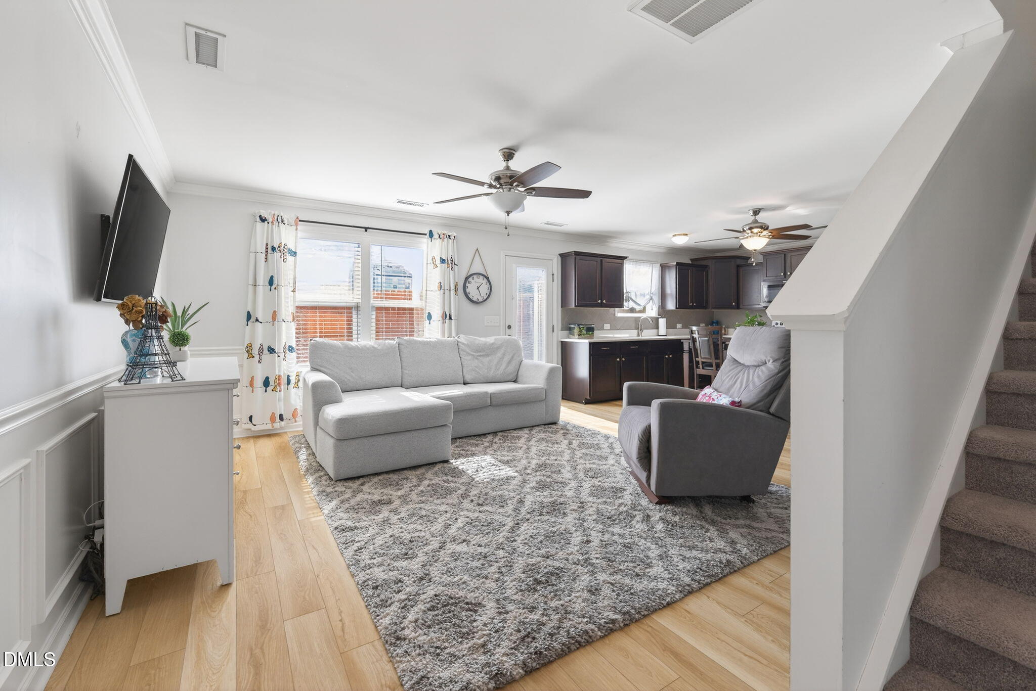 509 Houndstooth Lane Wendell, NC 27591 - Photo 5 of 33 a living room with furniture a flat screen tv and a fireplace