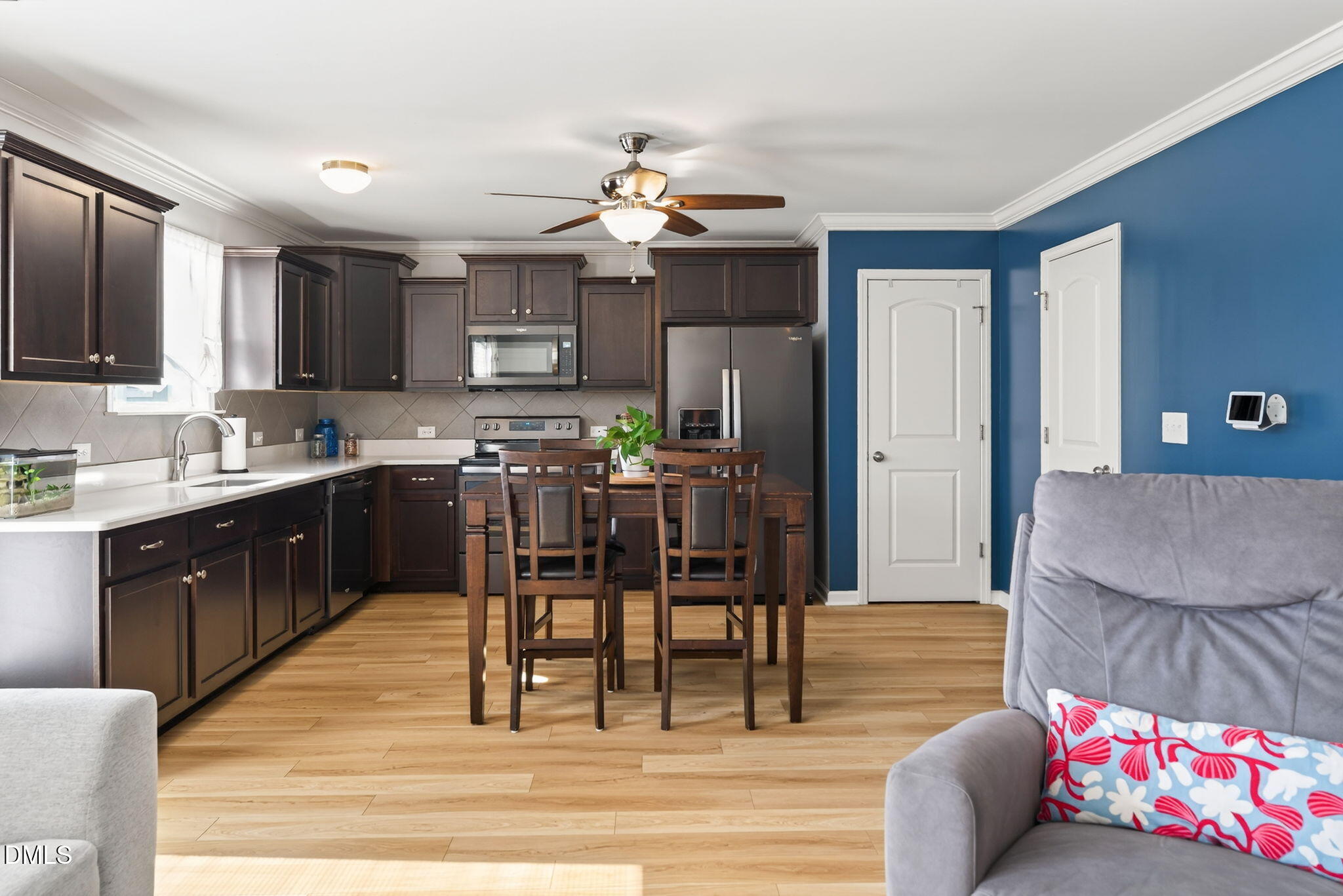 509 Houndstooth Lane Wendell, NC 27591 - Photo 8 of 33 a living room with stainless steel appliances kitchen island granite countertop furniture and a kitchen view