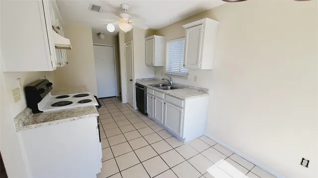 a kitchen with a stove and a sink