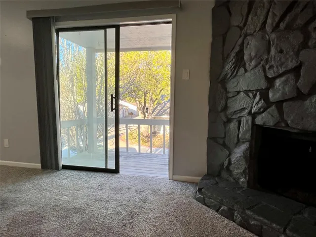 a view of outdoor space with sliding door and wooden floor