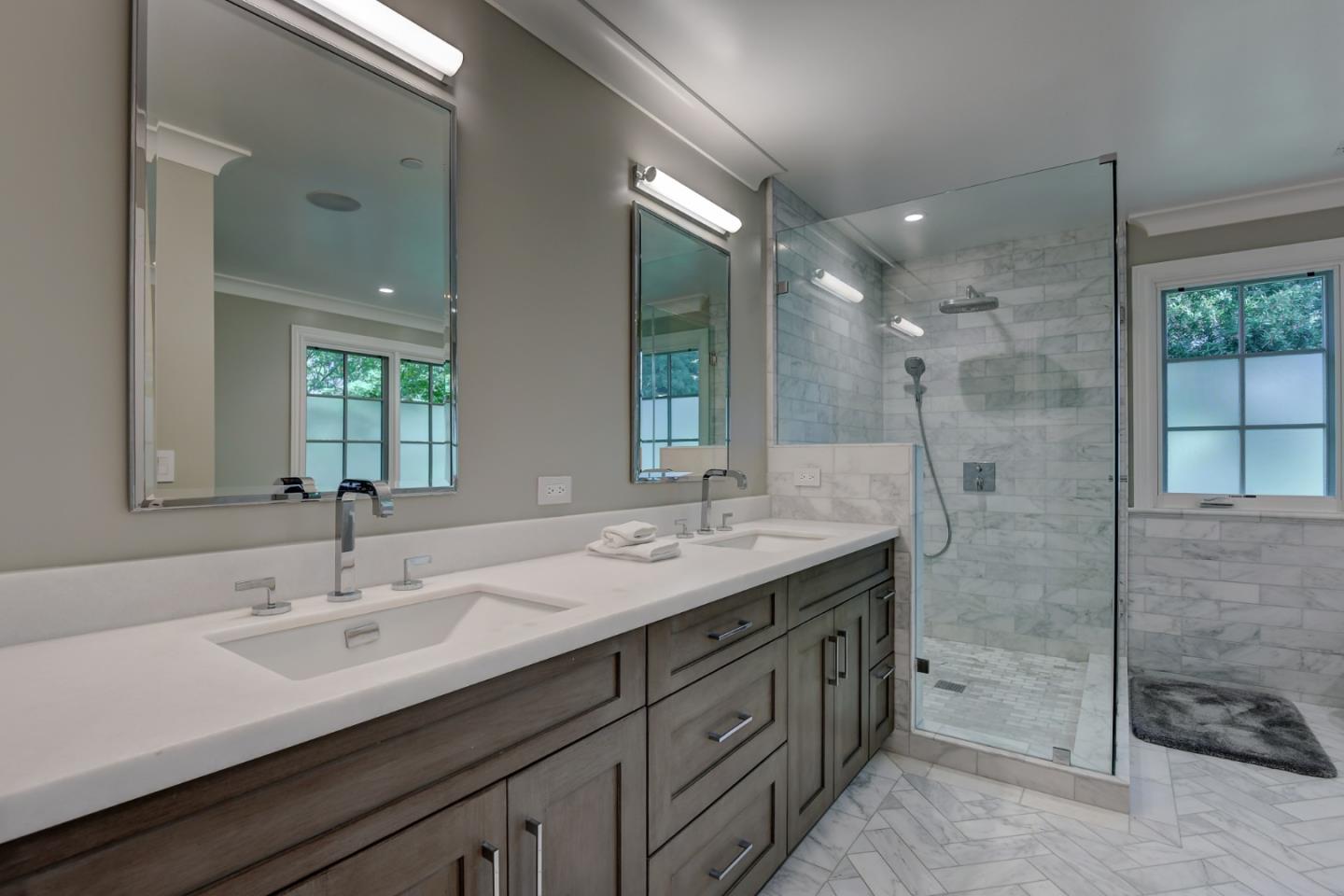 1025 Cabrillo Avenue Burlingame, CA 94010 - Photo 14 of 39 a bathroom with double vanity sinks and a shower