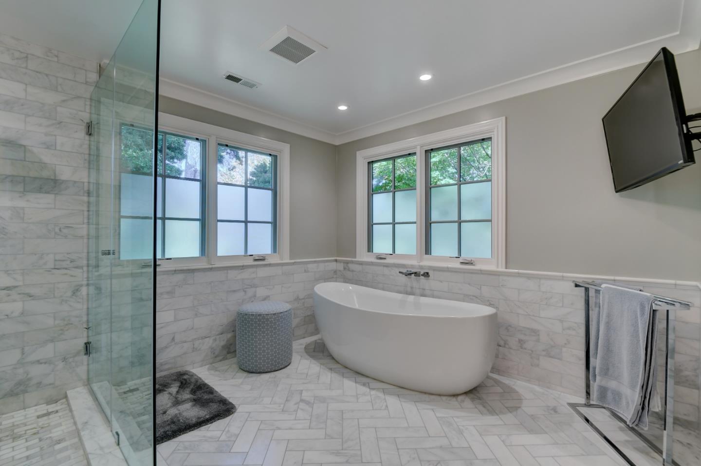 1025 Cabrillo Avenue Burlingame, CA 94010 - Photo 15 of 39 a bathroom with a bathtub and window