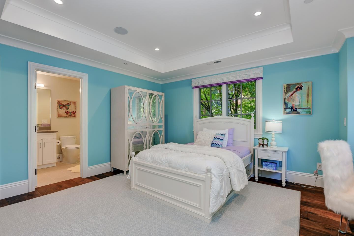 1025 Cabrillo Avenue Burlingame, CA 94010 - Photo 17 of 39 a bedroom with a bed a table and painting