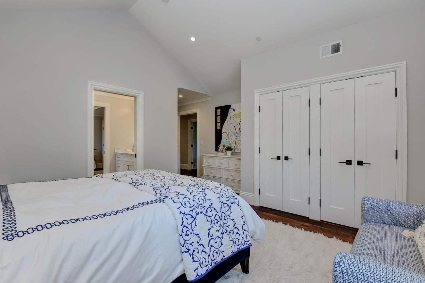 1025 Cabrillo Avenue Burlingame, CA 94010 - Photo 20 of 39 a spacious bedroom with a bed and a couch