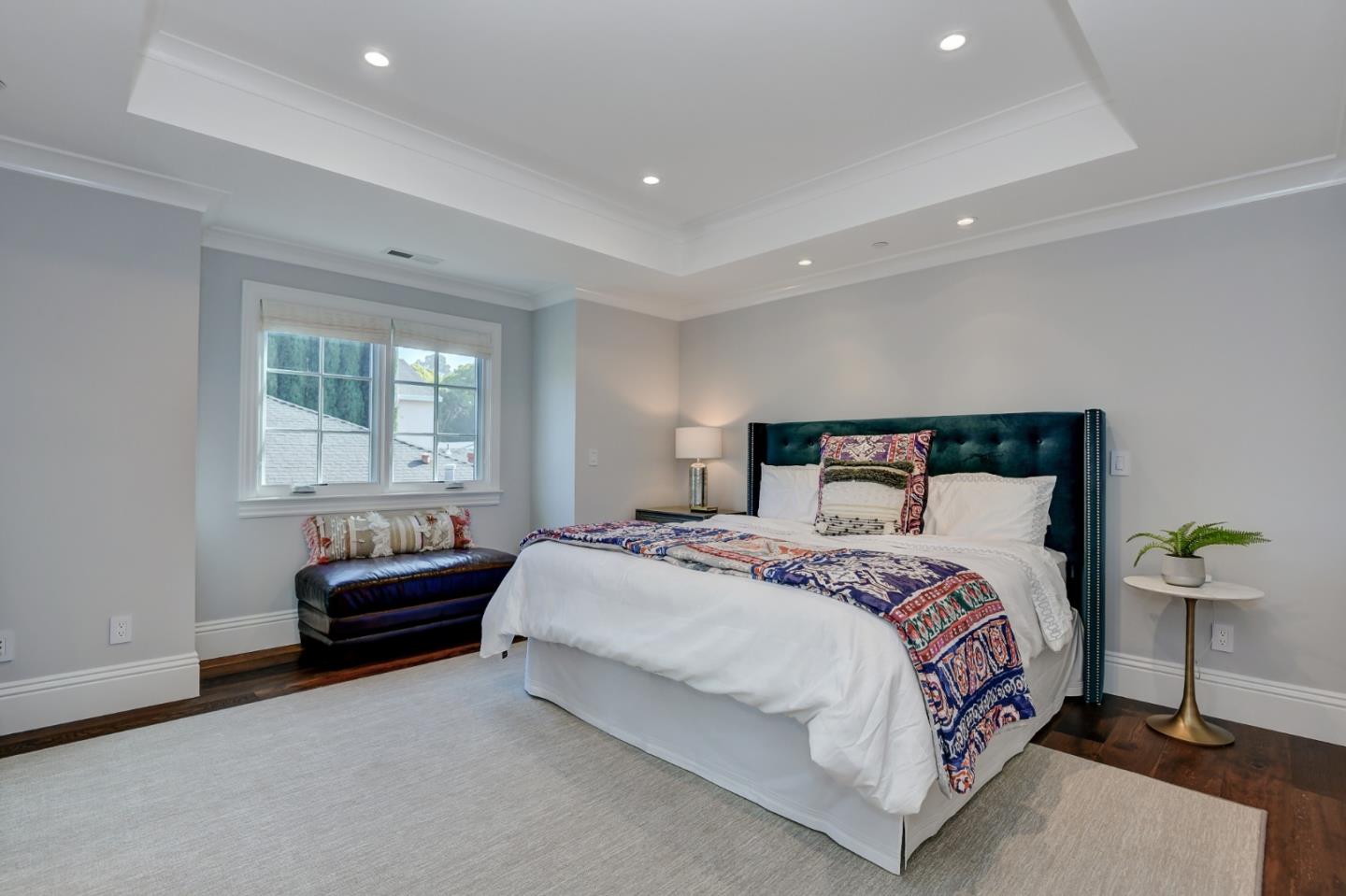 1025 Cabrillo Avenue Burlingame, CA 94010 - Photo 22 of 39 a bedroom with a bed and a couch