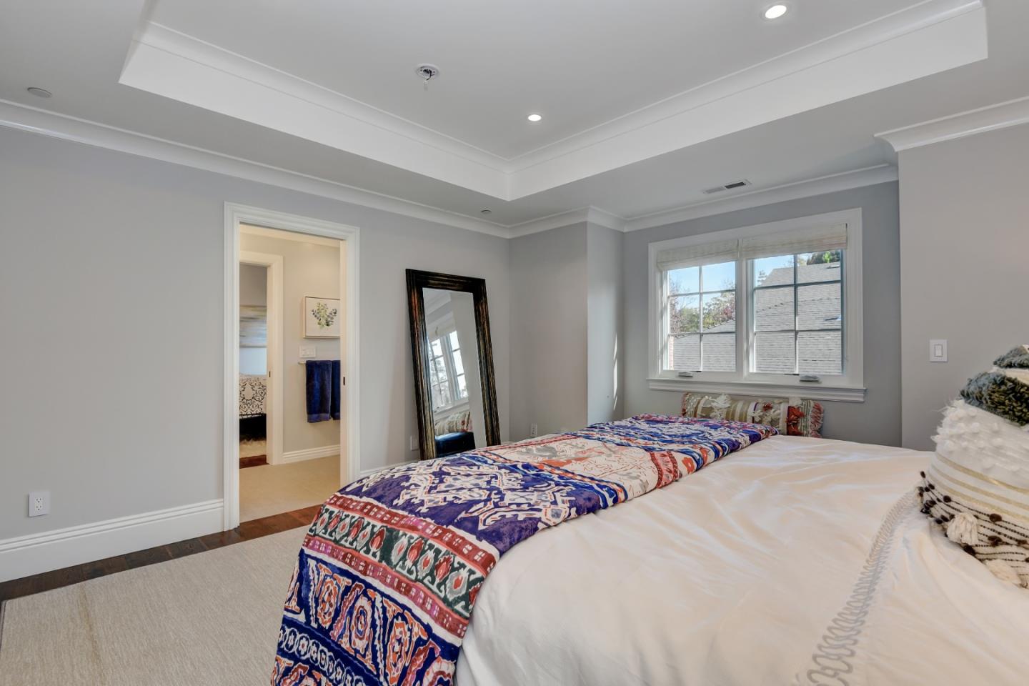 1025 Cabrillo Avenue Burlingame, CA 94010 - Photo 23 of 39 a bedroom with a large bed and windows